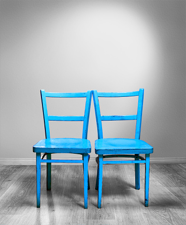 two blue chairs for the bride and groom