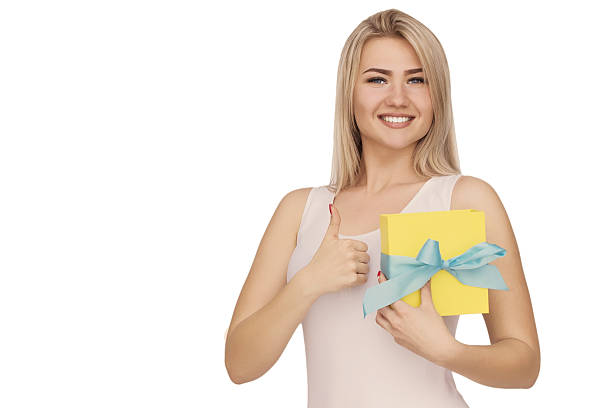 istock Young woman portrait holding gift 533442814