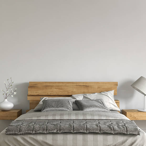 Modern urban bedroom with decoration with grey wall in background. 