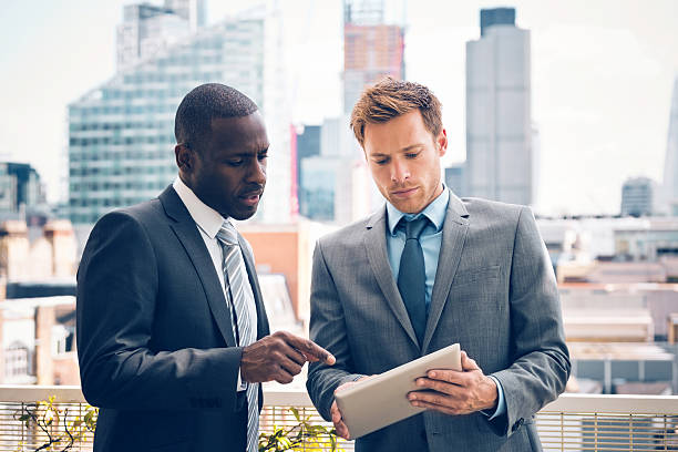 istock Business people discussing project on digital tablet 533443555