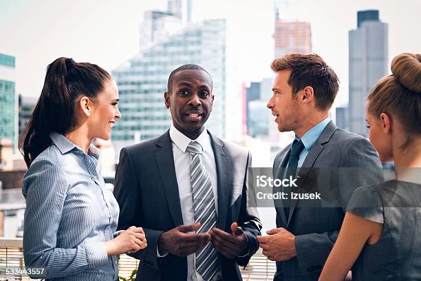 Business People Discussing Outdoor Stock Photo - Download Image Now - Laughing, Outdoors, Aspirations