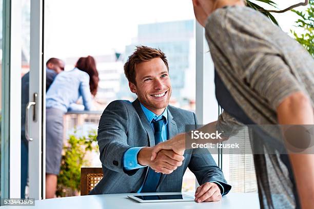 Businessman Shaking Hands With Businesswoman Stock Photo - Download Image Now - Smiling, Laughing, Handshake