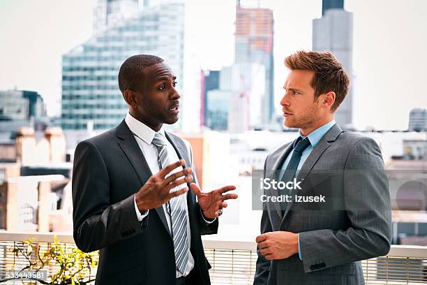 Business People Discussing Outdoor Stock Photo - Download Image Now - Finance, London - England, Professional Occupation