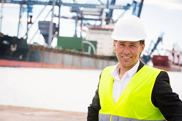 istock worker in industrial port 533443633