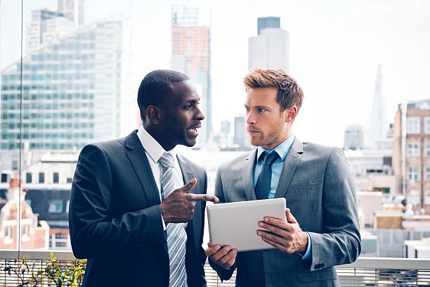 istock Business people discussing project on digital tablet 533443657
