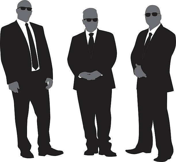 Security Men in Suits Silhouettes Vector silhouettes of three security men in suits with sunglasses. doorman stock illustrations
