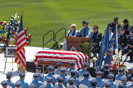 Kansas City, KS, USA - May 14, 2016: Officer Chris Blake, of the Kansas City, Kansas Police Department and long time friend of Detective Lancaster delivers his eulogy, during his memorial. 