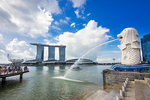 Singapore City, Singapore - June 1, 2014: View of Singapore landmarks Merlion statue and Marina Bay Sands Hotel in Singapore City. 