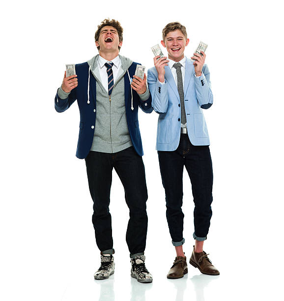 istock Happy brothers holding money 533445974