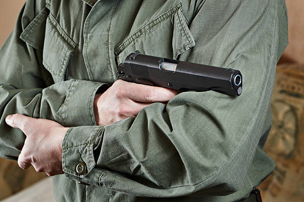 istock Soldier in uniform holding gun Colt 533446483