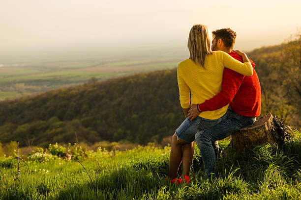 istock Young couple enjoying the view on mountain 533446986