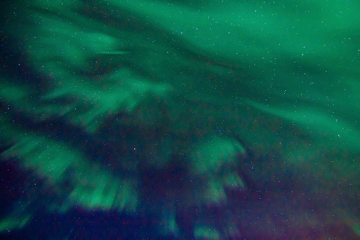 Spectacular celestial lights Aurora Borealis covering the night sky above Iceland in winter, which makes this Nordic country popular spot for tourist willing to witness one of the greatest natural phenomenoms. Shot with Canon EOS 60D, wide angle lens, f2.8, ISO 1600, long exposure of 6 seconds.