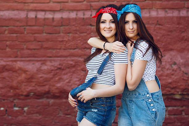 istock young twins girls, hugging 533447518