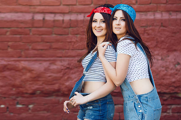 istock young twins girls smiling 533449050