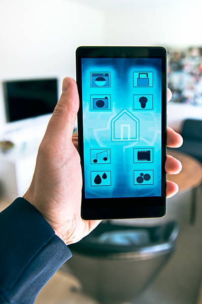 istock Controlling Internet of Things in smart home with phone app 533450930