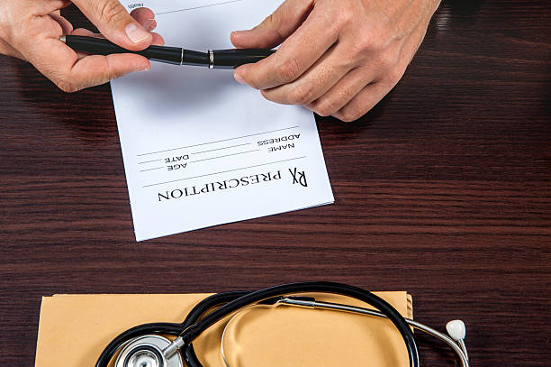 istock doctor writing prescription on the table 533451202