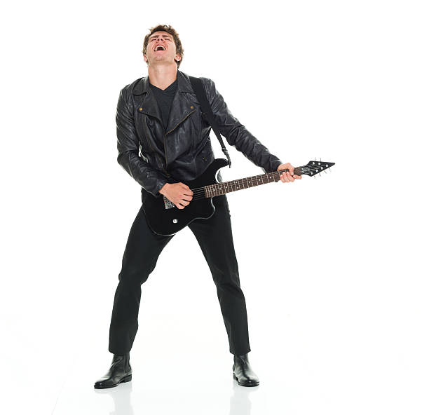 casual hombre tocando la guitarra - isolated on white studio shot guitar young men fotografías e imágenes de stock