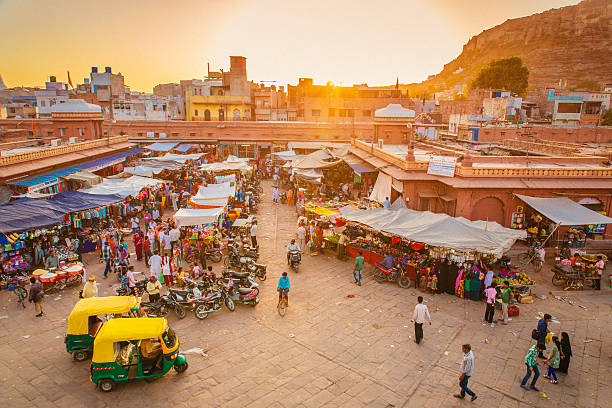 Jodhpur Market The beautiful market in Jodhpur’s Old City. People are visible in the image, walking standing or sitting in their rickshaws as it is the case in the foreground. india crowd stock pictures, royalty-free photos & images