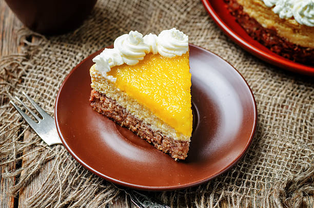 istock mango cheese cake decorated with whipped cream and mango puree 533453928