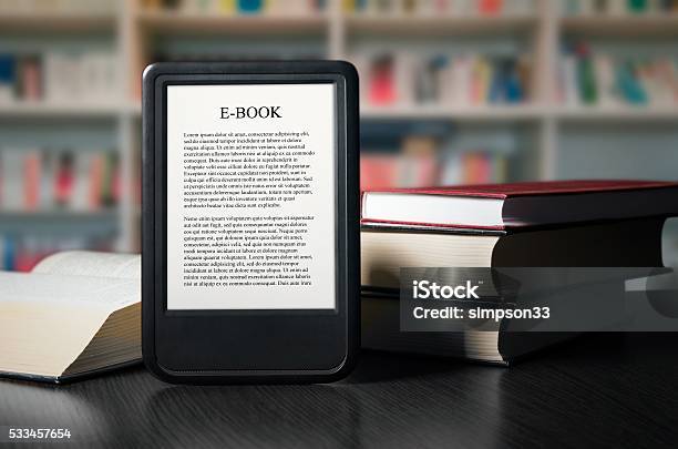 Ebook Reader Device On Desk In Library Stock Photo - Download Image Now - E-Reader, Book, Library