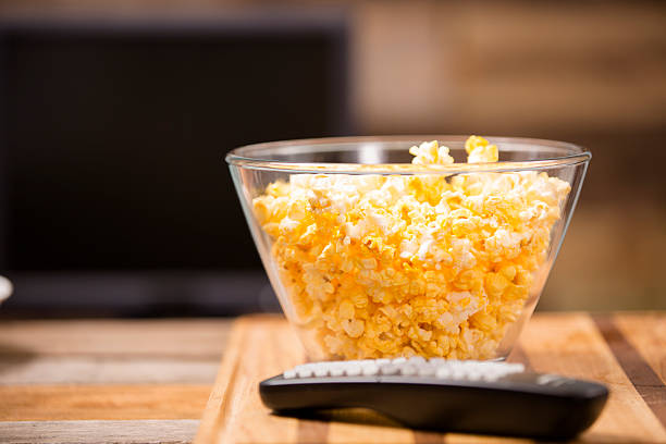 istock Watching show, movie on television at home. Popcorn, remote control. 533458113