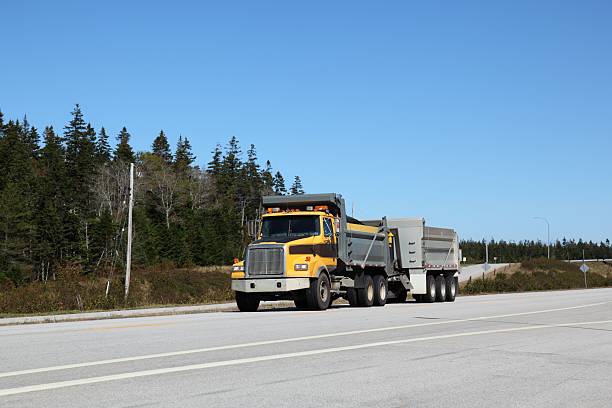 istock Dump truck and trailer on a highway 533460207