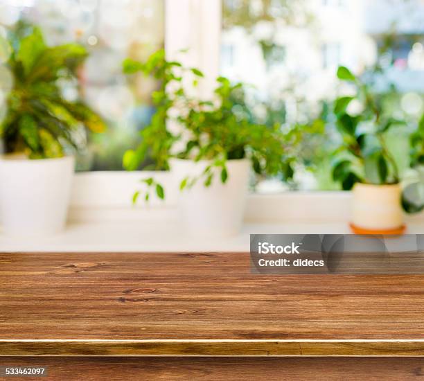 Wooden Table On Defocused Windowsill Background Stock Photo - Download Image Now - 2015, Blurred Motion, Brown