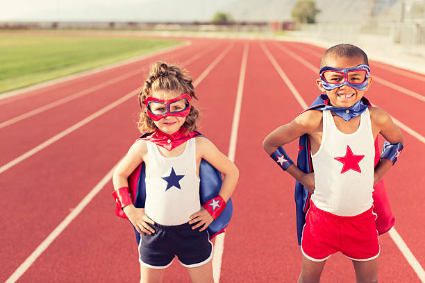 istock Young Children dressed as Superheroes Standing on Track 533462187