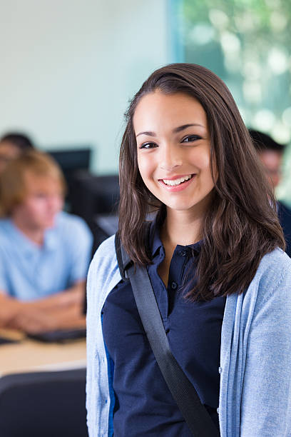 istock Student smiling in computer lab of private college prep school 533462835