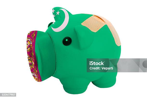 Closed Piggy Rich Bank With Bandage In Colors Of Turkmenistan Stock Photo - Download Image Now