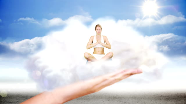 Giant hand presenting woman doing yoga