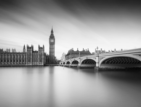 Houses of Parliament, Big Ben and Westminster Bridge from the edge of the River Thames, London. Long Exposure.