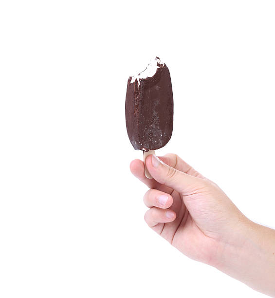 istock Hand holding chocolate ice cream. 533479561