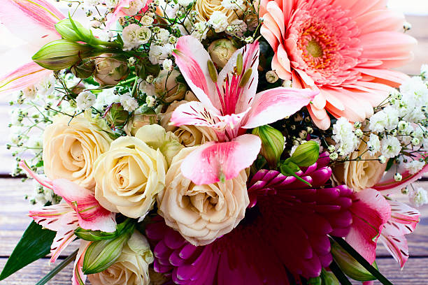 istock Flowers rose on wooden surface. 533480633