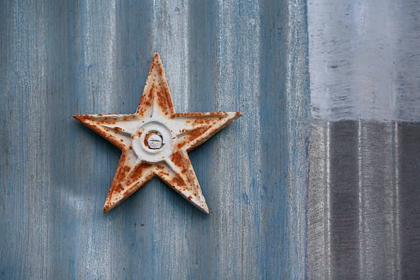 Metal star on barn siding red white and blue