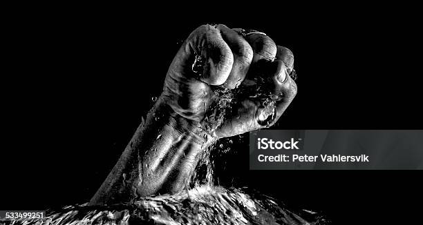 Fist Breaking Trough Water Stock Photo - Download Image Now - Fist, Strength, Punching