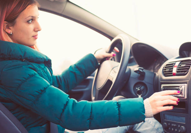 istock Young driver changing radio stations 533499617