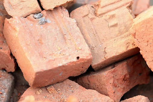 Building materials: red bricks for construction piled on the floor of a street in Godawari-Lalitpur distr.-Bagmati zone-Nepal.