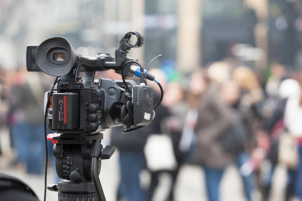 istock Filming an event with a video camera 533502333