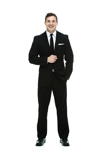 istock Smiling businessman standing & looking at camera 533503829
