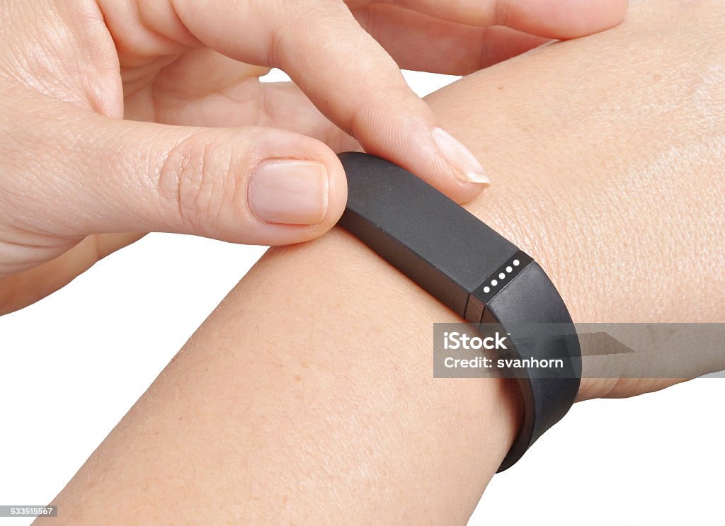 Activity tracker Activity tracker on a woman's wrist 2015 Stock Photo