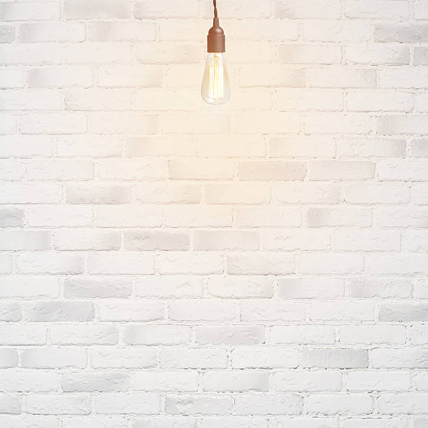 istock white brick wall background with retro lamp 533515601