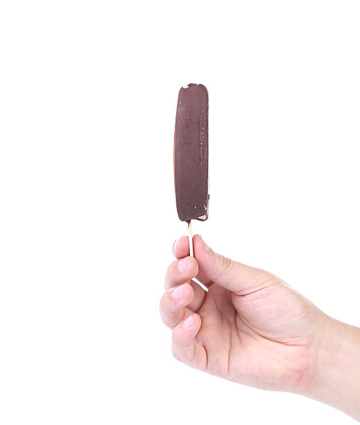 istock Hand holding chocolate ice cream. 533517243