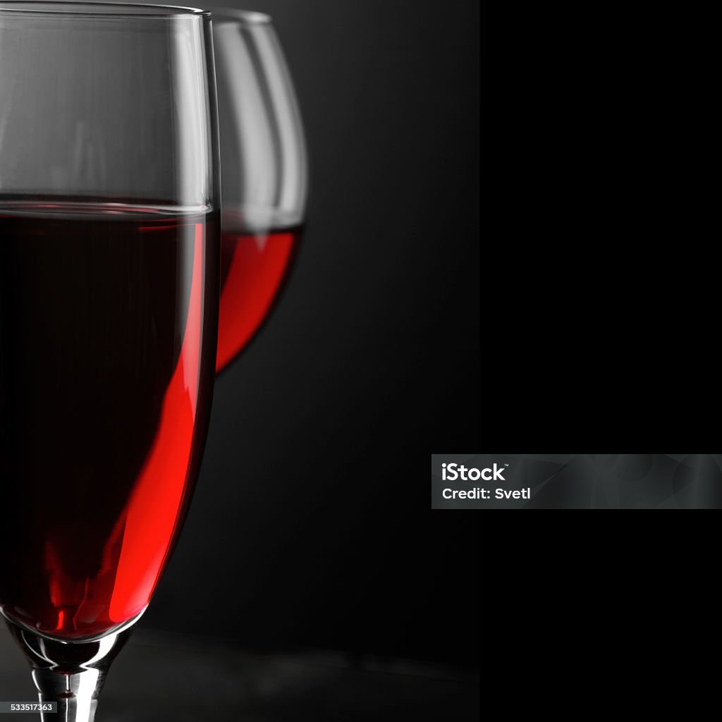 Red wine close-up Two glass of red wine close-up on black background. Soft focus, shallow DOF. 2015 Stock Photo