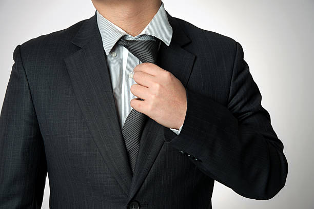 istock Businessman loosening necktie 533517829