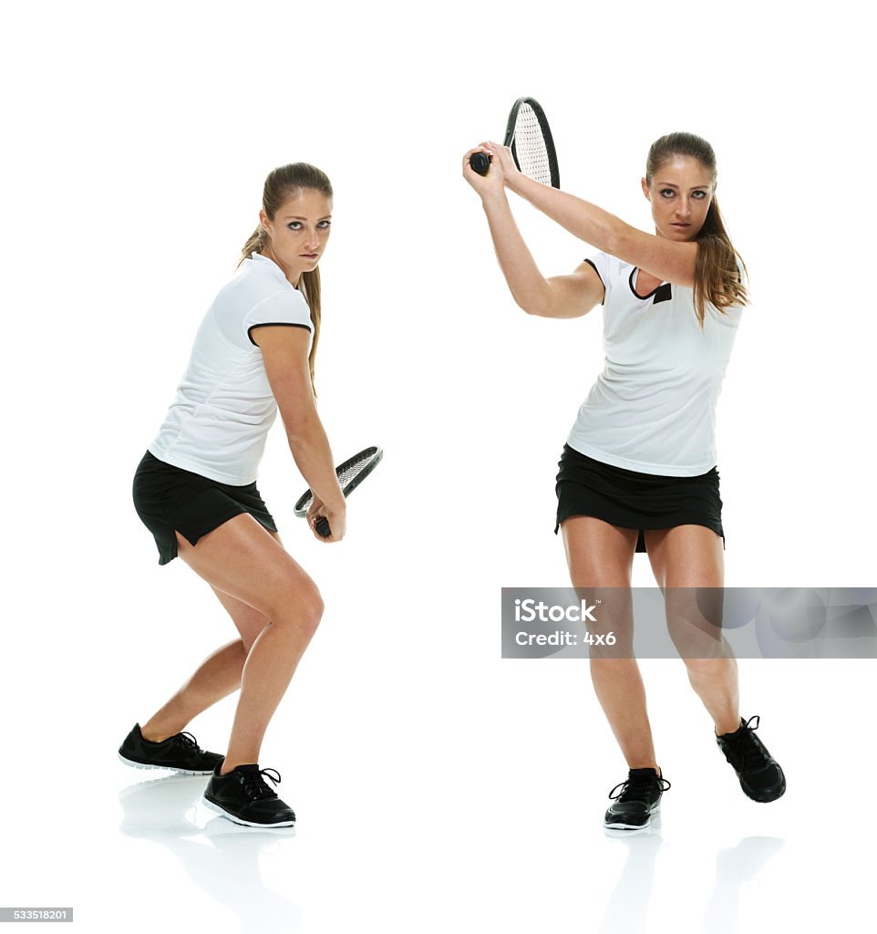 Two female athletes playing tennis Two female athletes playing tennishttp://www.twodozendesign.info/i/1.png Serious Stock Photo