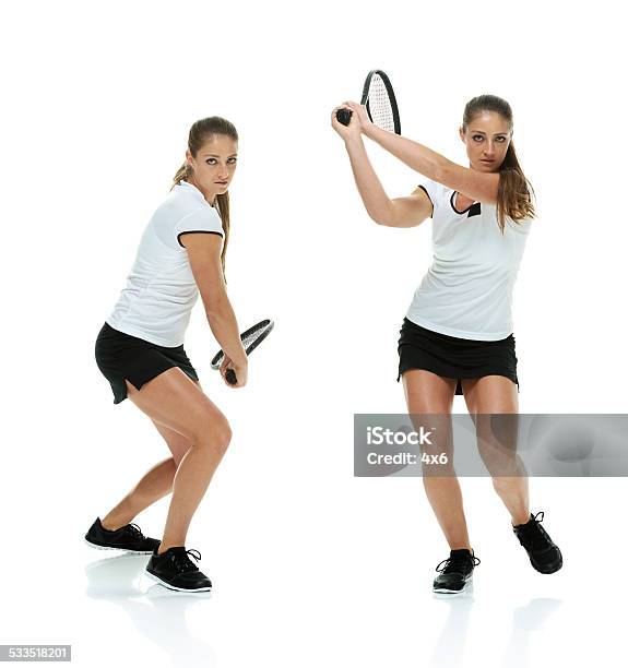 Two Female Athletes Playing Tennis Stock Photo - Download Image Now - Serious, Tennis, 20-24 Years