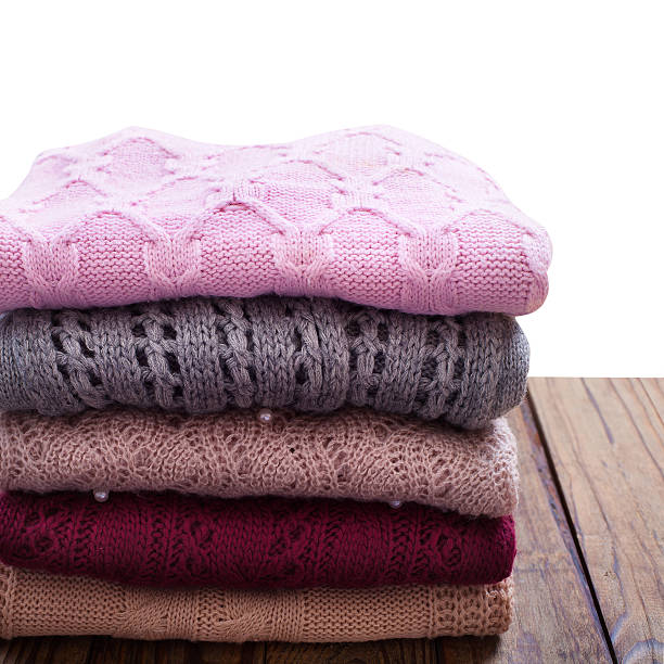 istock Knitting clothes on wooden background. 533518245
