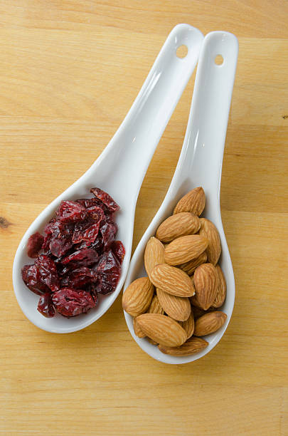 Spoons of Cranberries and Almonds Vertical