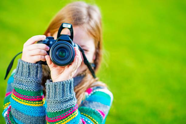 istock Girl Taking Pictures by DSLR 533521745